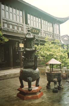 Ancient Mountain Top Taoist Temple with Ancient Urn on the  Foreground